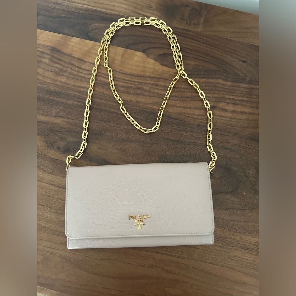 Prada leather wallet on a chain in powder pink